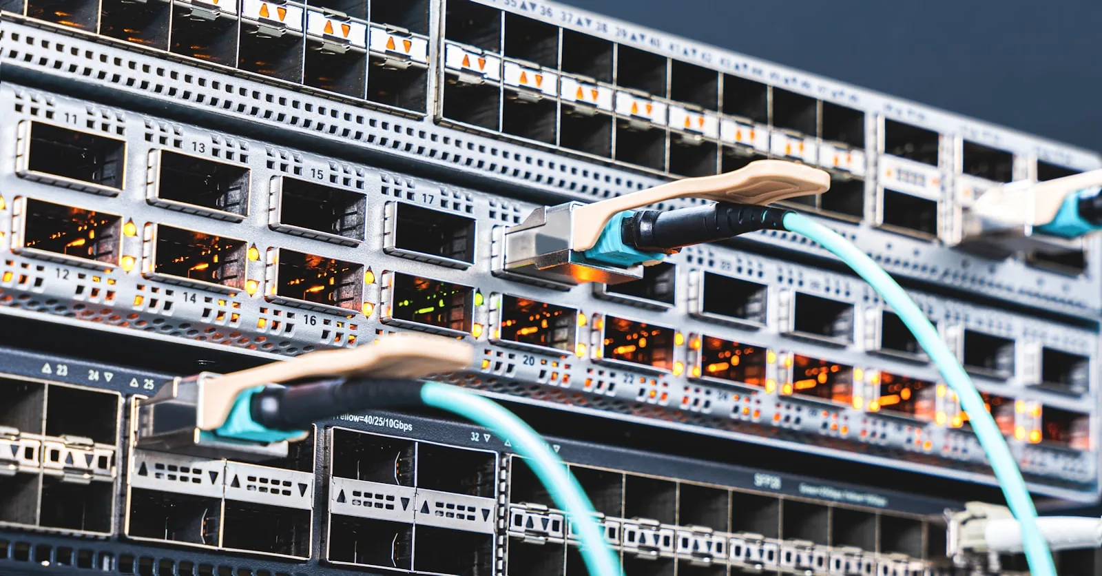 Network switch with lit ports and teal fibre connections