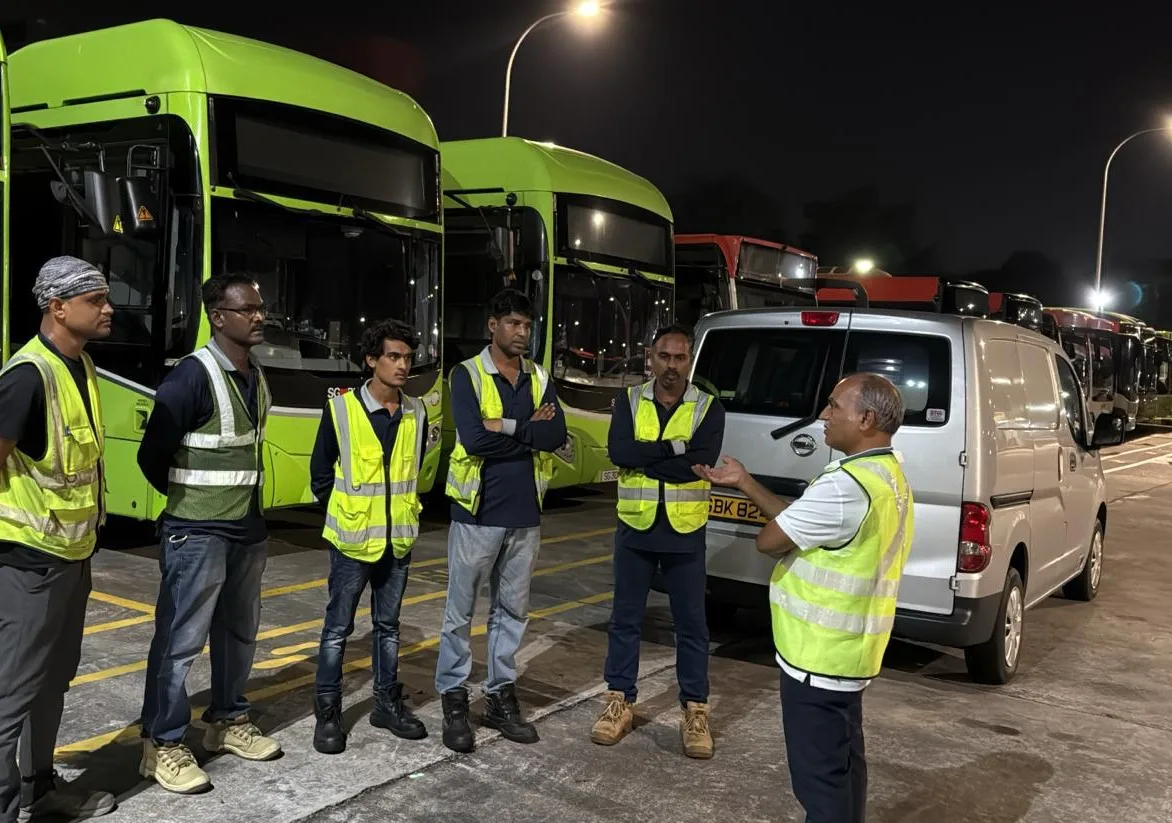 CCST field crew in hi-vis vests at a vehicle depot